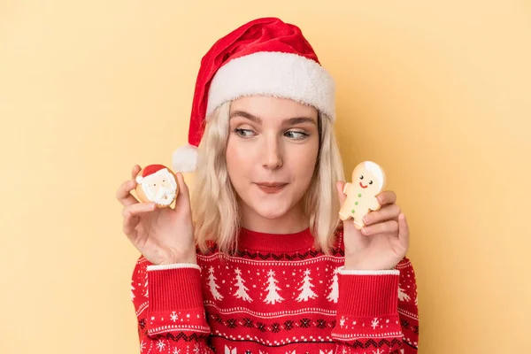 Young Caucasian Woman Holding Christmas Cookies Isolated Yellow Background — Photo