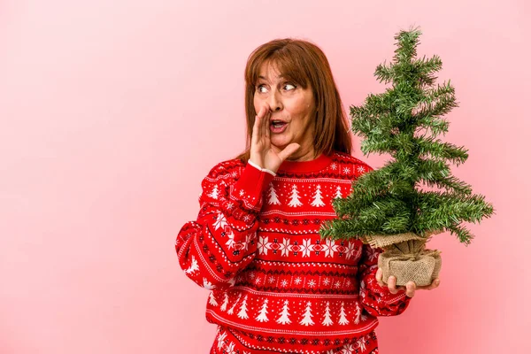 Middle Age Caucasian Woman Holding Christmas Tree Isolated Pink Background — Stock Photo, Image