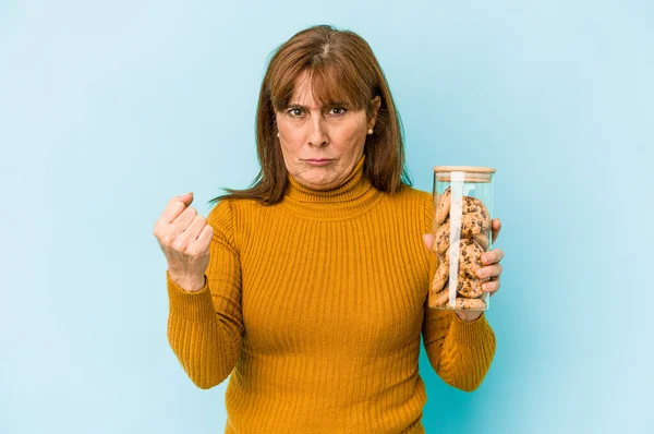 Middle Age Caucasian Woman Holding Cookies Jar Isolated Blue Background — Fotografia de Stock