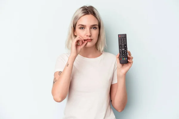Young Caucasian Woman Holding Controller Isolated Blue Background Fingers Lips — Foto de Stock