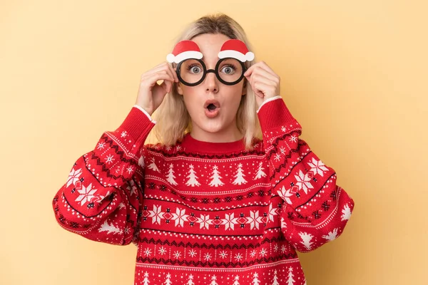 Young Caucasian Woman Holding Christmas Props Isolated Yellow Background — 스톡 사진