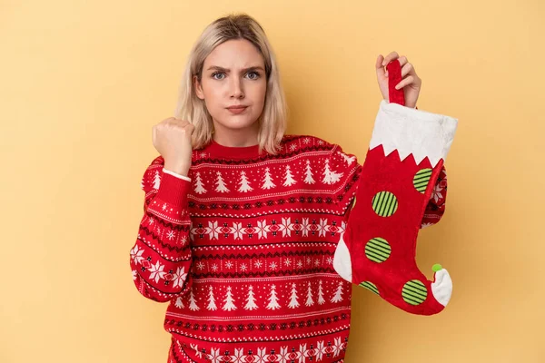 Young Caucasian Woman Holding Elf Sock Isolated Yellow Background Showing — Stock Photo, Image