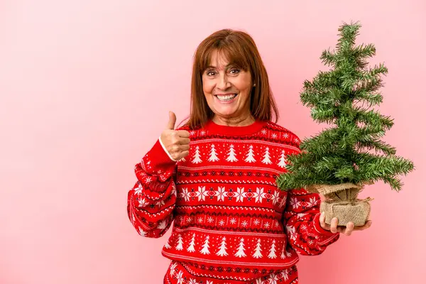 Middle Age Caucasian Woman Holding Christmas Tree Isolated Pink Background — Stock Photo, Image