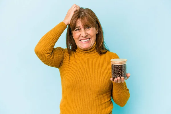 Middle Age Woman Holding Coffee Jar Isolated Blue Background — Stockfoto