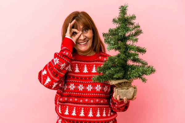 Middle Age Caucasian Woman Holding Christmas Tree Isolated Pink Background — Stock Photo, Image