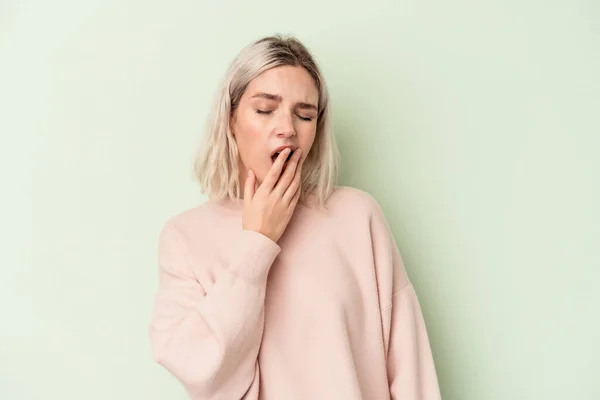 Young Caucasian Woman Isolated Green Background Yawning Showing Tired Gesture — Stock Photo, Image