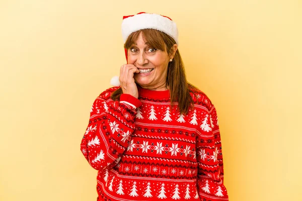 Middle Age Caucasian Woman Celebrating Christmas Isolated Yellow Background Biting — Photo