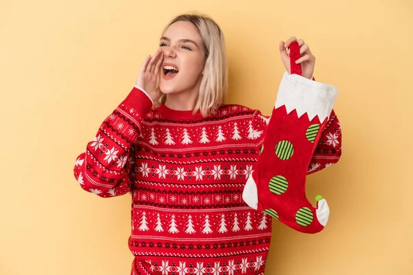 Young Caucasian Woman Holding Elf Sock Isolated Yellow Background Shouting — Stock Photo, Image