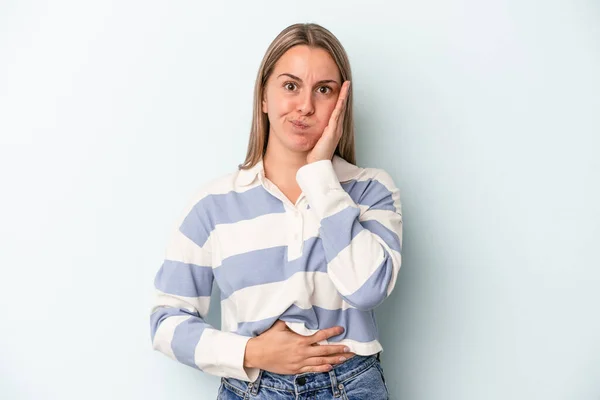 Young Caucasian Woman Isolated Blue Background Blows Cheeks Has Tired — Stock Photo, Image