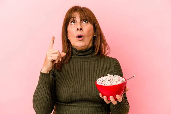 Middle Age Caucasian Woman Holding Bowl Cereals Isolated Pink Background — стоковое фото