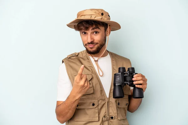 Young Mixed Race Man Holding Binoculars Isolated Blue Background Pointing — 图库照片