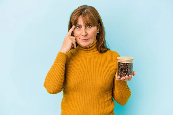 Middle Age Woman Holding Coffee Jar Isolated Blue Background — Stockfoto