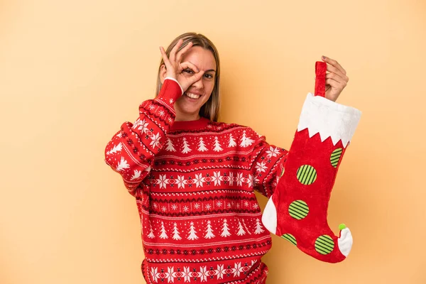 Young Caucasian Woman Holding Elf Sock Isolated Yellow Background Excited — Stock Photo, Image