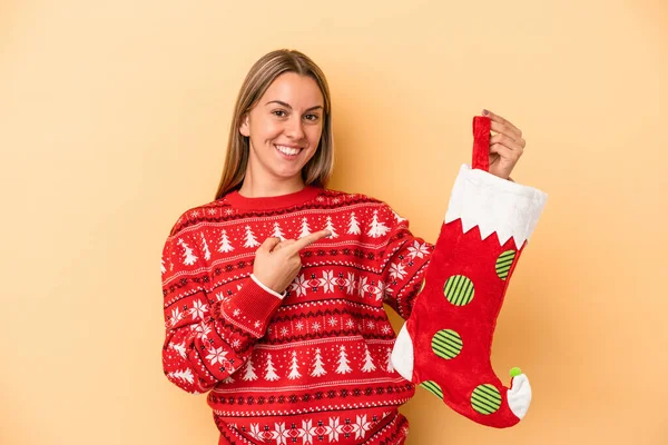 Young Caucasian Woman Holding Elf Sock Isolated Yellow Background Smiling — Stock Photo, Image