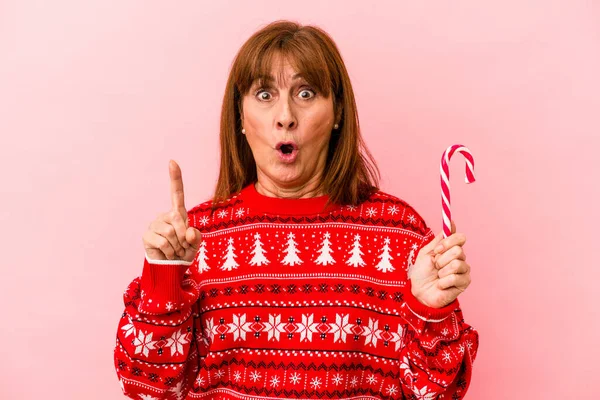 Middle Age Caucasian Woman Holding Christmas Stick Isolated Pink Background — Photo