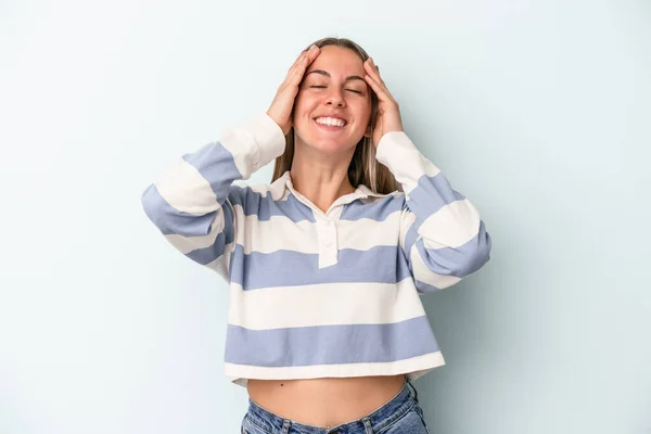 Young Caucasian Woman Isolated Blue Background Laughs Joyfully Keeping Hands — Stock Photo, Image