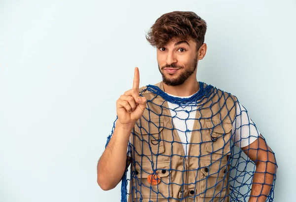 Young Mixed Race Fisherman Holding Net Isolated Blue Background Showing — Fotografia de Stock