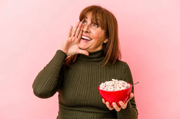 Middle Age Caucasian Woman Holding Bowl Cereals Isolated Pink Background — стоковое фото