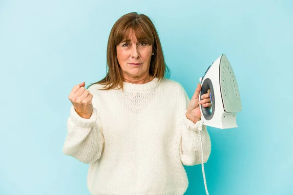 Middle Age Caucasian Woman Holding Iron Isolated Blue Background Showing — Φωτογραφία Αρχείου