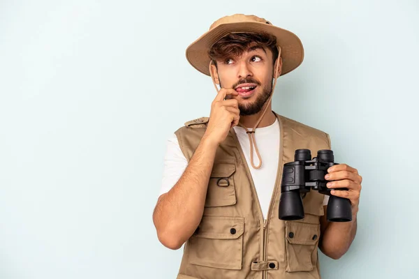 Young Mixed Race Man Holding Binoculars Isolated Blue Background Relaxed — 图库照片