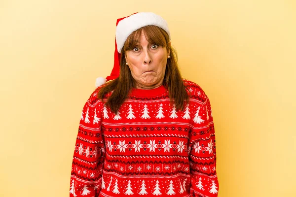 Middle Age Caucasian Woman Celebrating Christmas Isolated Yellow Background Shrugs — Φωτογραφία Αρχείου