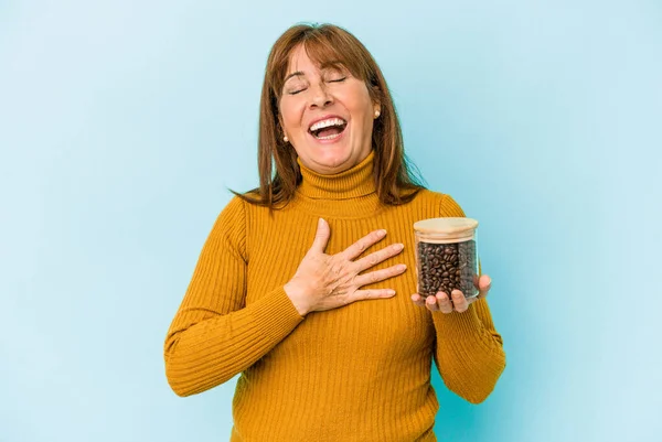 Middle Age Woman Holding Coffee Jar Isolated Blue Background — Fotografia de Stock