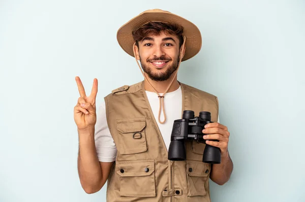 Young Mixed Race Man Holding Binoculars Isolated Blue Background Showing — 图库照片