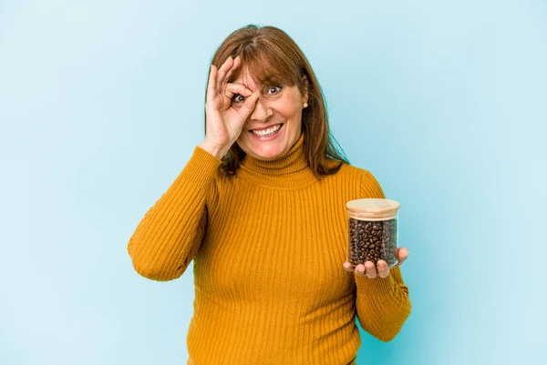 Middle Age Woman Holding Coffee Jar Isolated Blue Background — Fotografia de Stock