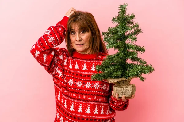 Middle Age Caucasian Woman Holding Christmas Tree Isolated Pink Background — Stock Photo, Image