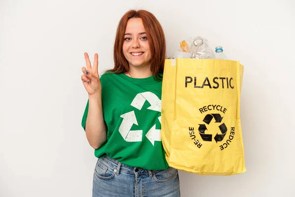 Young Caucasian Woman Recycled Plastic Isolated White Background Showing Number — Stok fotoğraf