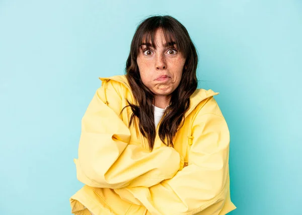 Young Argentinian Woman Isolated Blue Background Blows Cheeks Has Tired — Foto de Stock