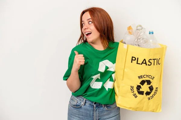 Young Caucasian Woman Recycled Plastic Isolated White Background Points Thumb — Fotografia de Stock