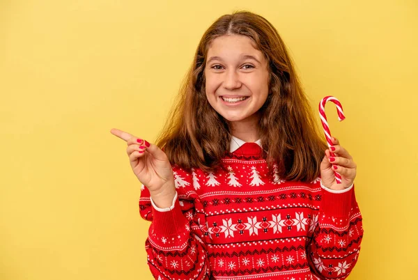Little Caucasian Girl Holding Christmas Stick Isolated Yellow Background Smiling — 스톡 사진