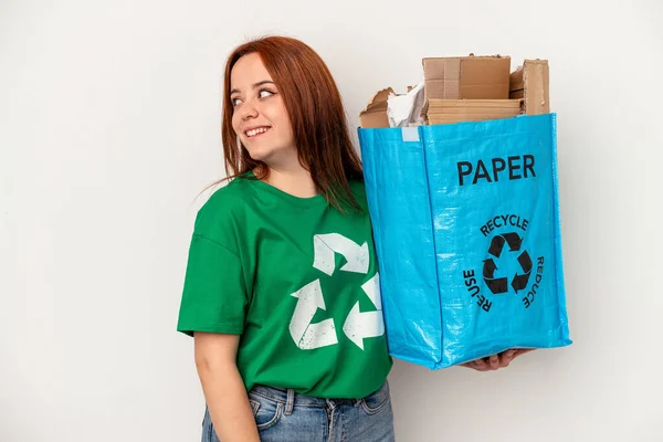 Young Caucasian Woman Recycled Paper Isolated White Background Looks Aside — ストック写真