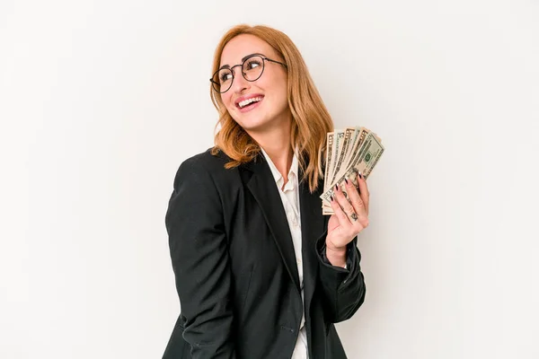 Young Business Caucasian Woman Holding Banknotes Isolated White Background Looks — Φωτογραφία Αρχείου