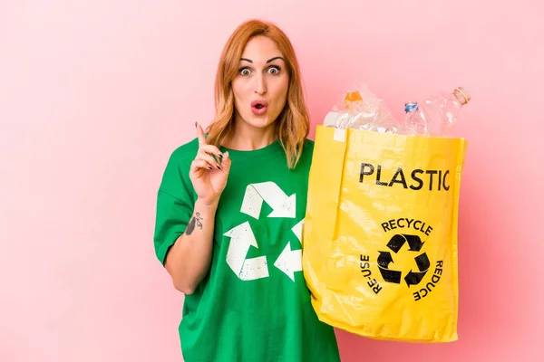 Young Caucasian Woman Recycled Plastic Isolated Pink Background Having Some — Stockfoto