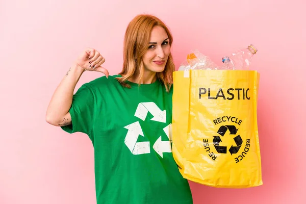 Young Caucasian Woman Recycled Plastic Isolated Pink Background Feels Proud — Fotografia de Stock