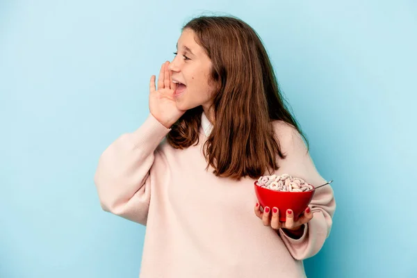 Little Caucasian Girl Holding Bowl Cereals Isolated Blue Background Shouting — стоковое фото