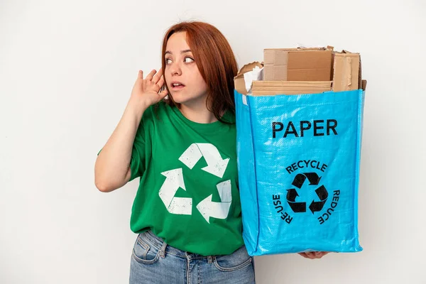 Young Caucasian Woman Recycled Paper Isolated White Background Trying Listening — ストック写真