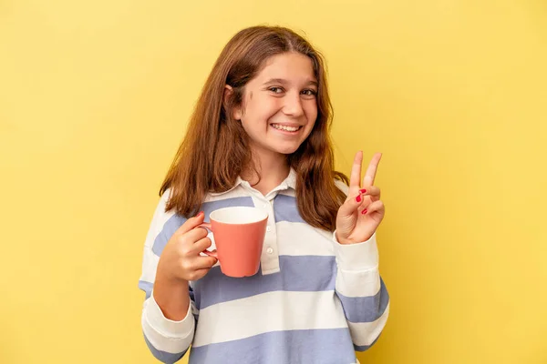 Little Caucasian Girl Holding Pink Mug Isolated Yellow Background Showing — Stock Photo, Image
