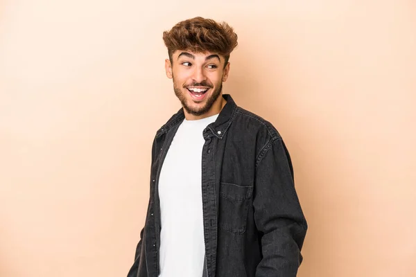 Young Arab Man Isolated Beige Background Laughs Closes Eyes Feels — Stock fotografie