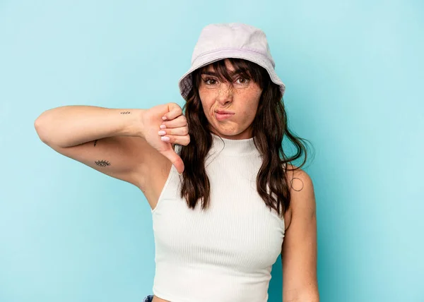 Young Argentinian Woman Isolated Blue Background Showing Thumb Disappointment Concept — 스톡 사진