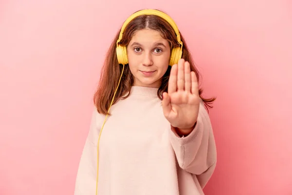 Little Caucasian Girl Listening Music Isolated Pink Background Standing Outstretched — Foto de Stock