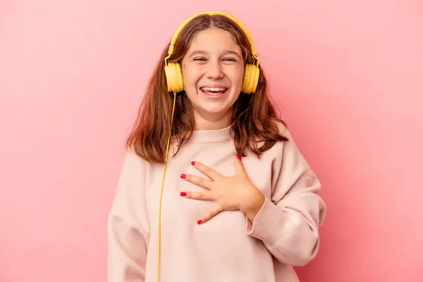Little Caucasian Girl Listening Music Isolated Pink Background Laughs Out — Foto de Stock