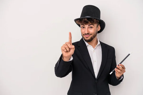 Young Arab Wizard Man Holding Wand Isolated White Background Showing — Zdjęcie stockowe