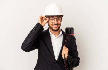 Young mixed race architect man wearing a helmet isolated on grey background excited keeping ok gesture on eye.