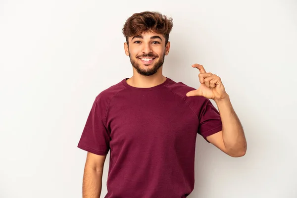 Young Mixed Race Man Isolated Grey Background Holding Something Little — Stockfoto