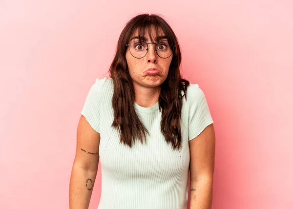 Young Argentinian Woman Isolated Pink Background Shrugs Shoulders Open Eyes —  Fotos de Stock