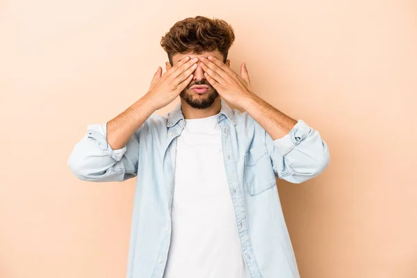 Young Arab Man Isolated Beige Background Afraid Covering Eyes Hands — Stockfoto