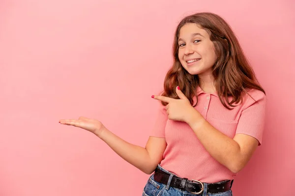 Little Caucasian Girl Isolated Pink Background Excited Holding Copy Space — Stock Photo, Image